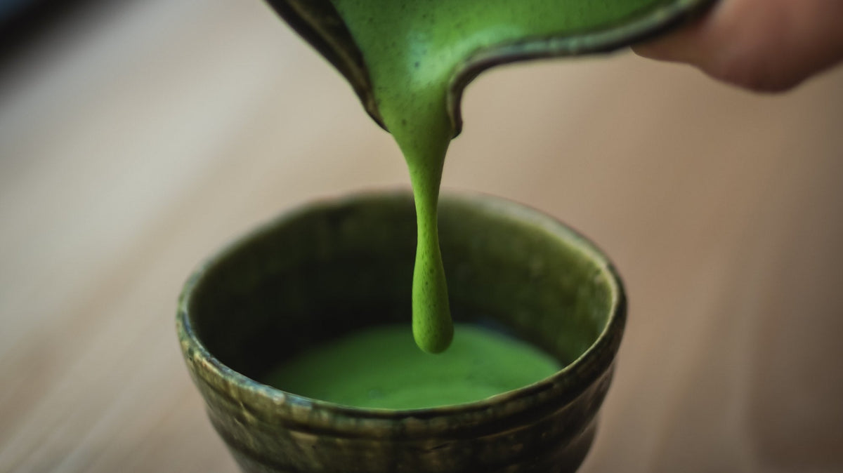 Vivid stone-milled Matcha whisked to a fine foam — UNEARTHED Gallery München