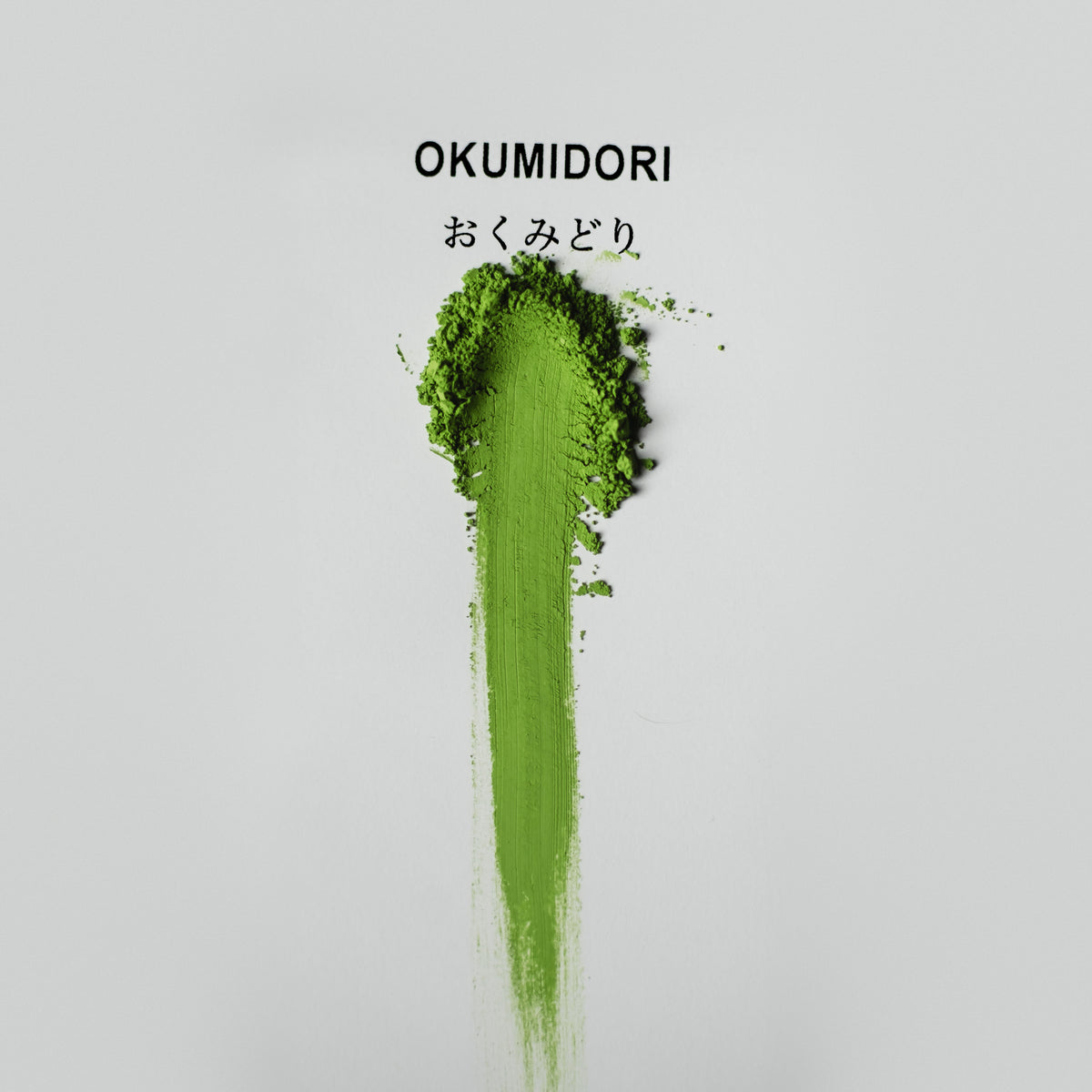 Okumidori Matcha, powder brushed into a stripe on white paper