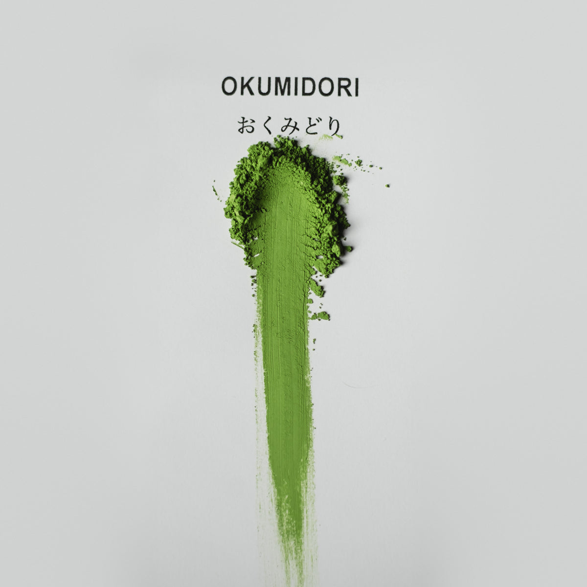Okumidori Matcha, powder brushed into a stripe on white paper