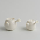 白乳 Bairu Side-Handle Teapot teapot, regular size and 50 ml mini side by side, Buchangqi Studio, Dehua porcelain, UNEARTHED Gallery München