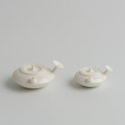 龙池 Longchi Side-Handle Teapot teapot, regular size and 50 ml mini side by side, Buchangqi Studio, Dehua porcelain, UNEARTHED Gallery München