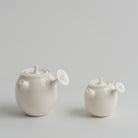 谷帘 Gulian Side-Handle Teapot teapot, regular size and 50 ml mini side by side, Buchangqi Studio, Dehua porcelain, UNEARTHED Gallery München
