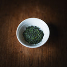 Hoshino Hon Gyokuro Zairai dry leaf in a white cup, seen from above