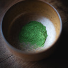 Chiyomukashi Matcha, powder sifted into a wood-glazed bowl