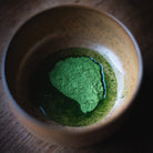 Chiyomukashi Matcha, hot water around the powder in the wood-glazed bowl