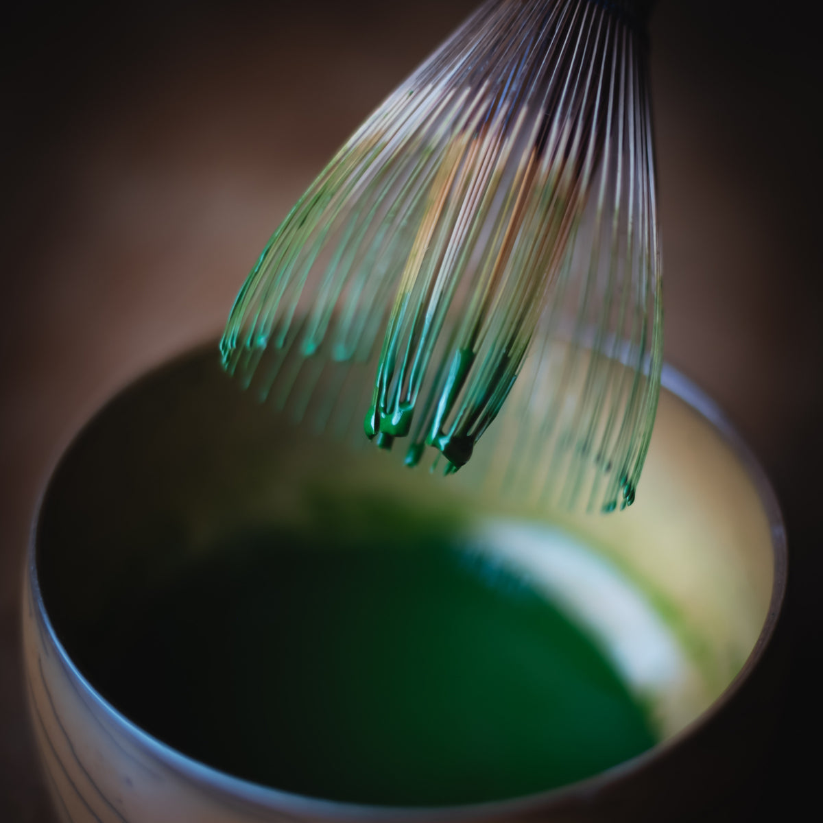 Chiyomukashi Matcha, bamboo whisk lifted from the wood-glazed bowl