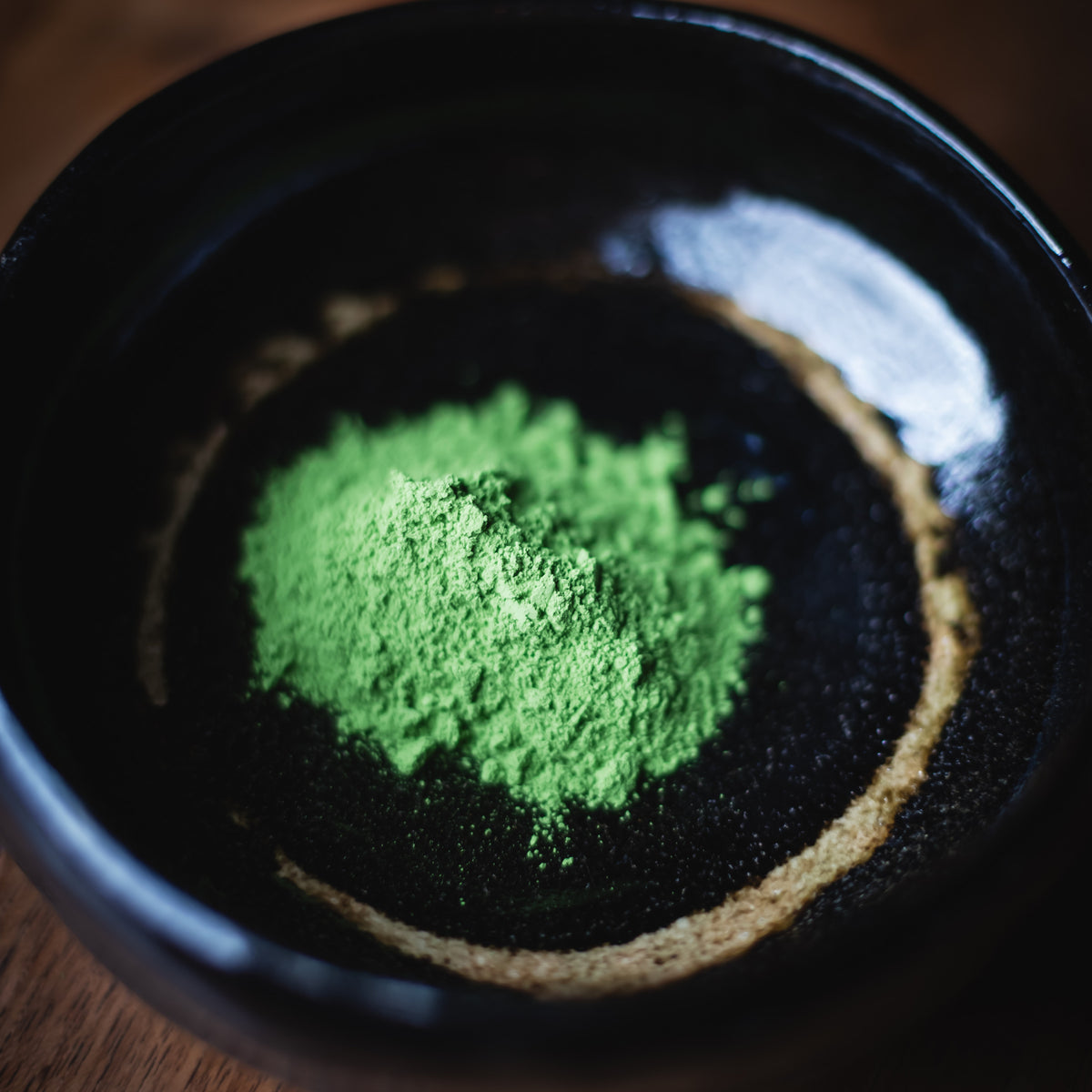 Choan Matcha, powder in a black glazed bowl