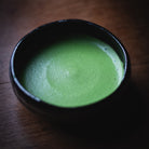 Choan Matcha, finished usucha in the black glazed bowl on the wooden table