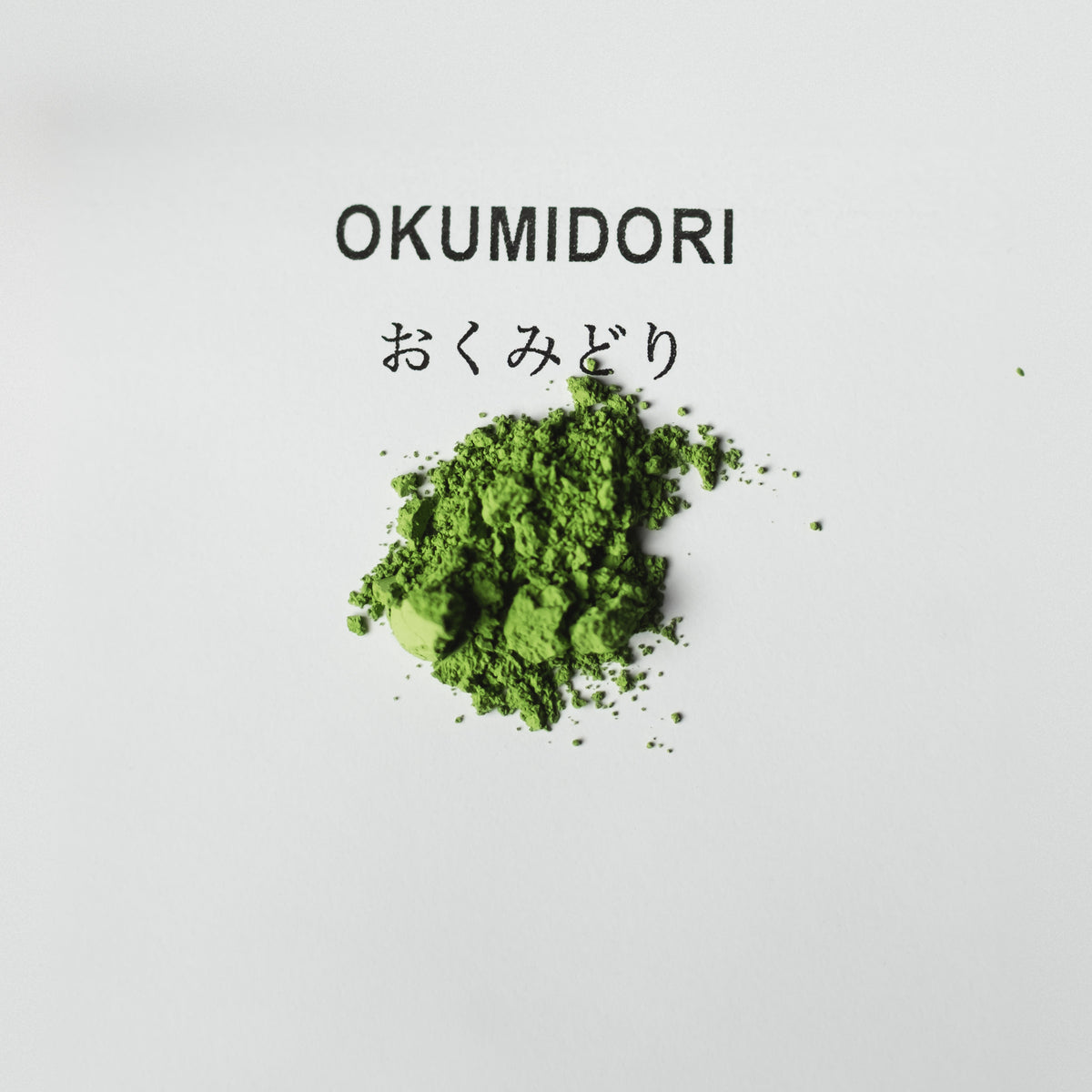 Okumidori Matcha, powder heap on white paper