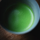 Okumidori Matcha, fine foam forming in the grey bowl
