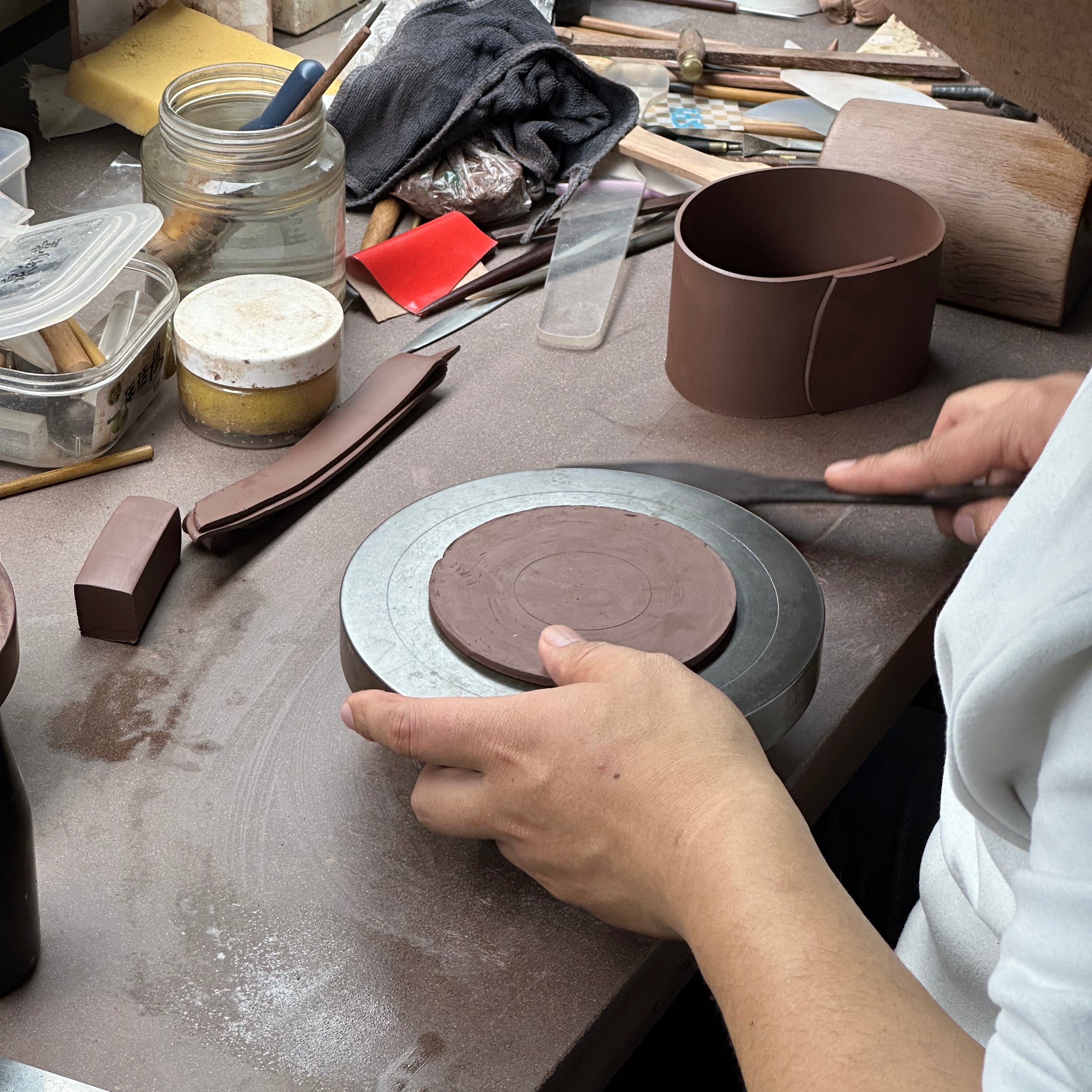 Studio Li — the potter forming a pot